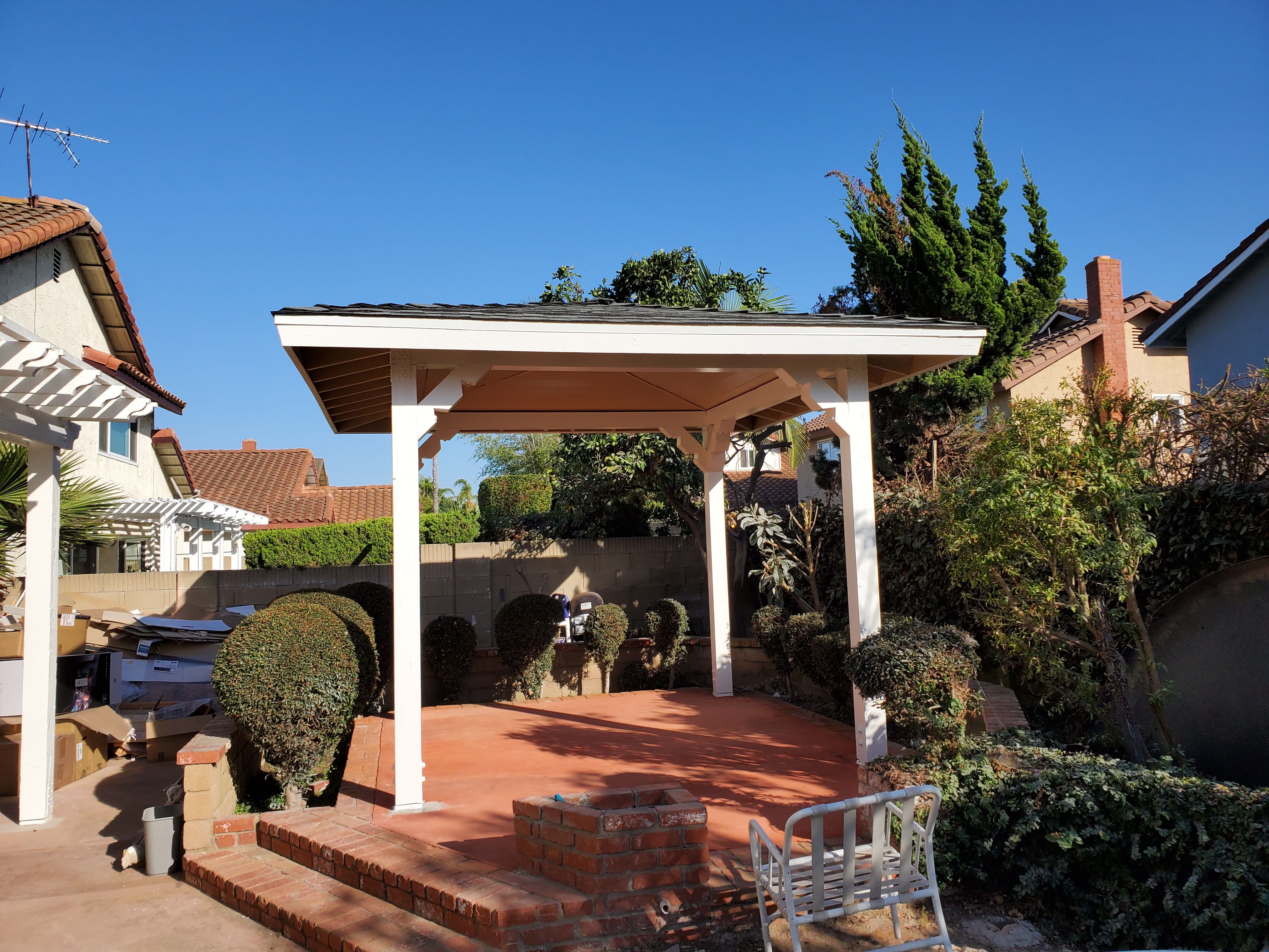 Garden Grove Backyard Patio Project - Additional detail image 2 of Custom wooden patio structure with pitched roof and pergola restoration.